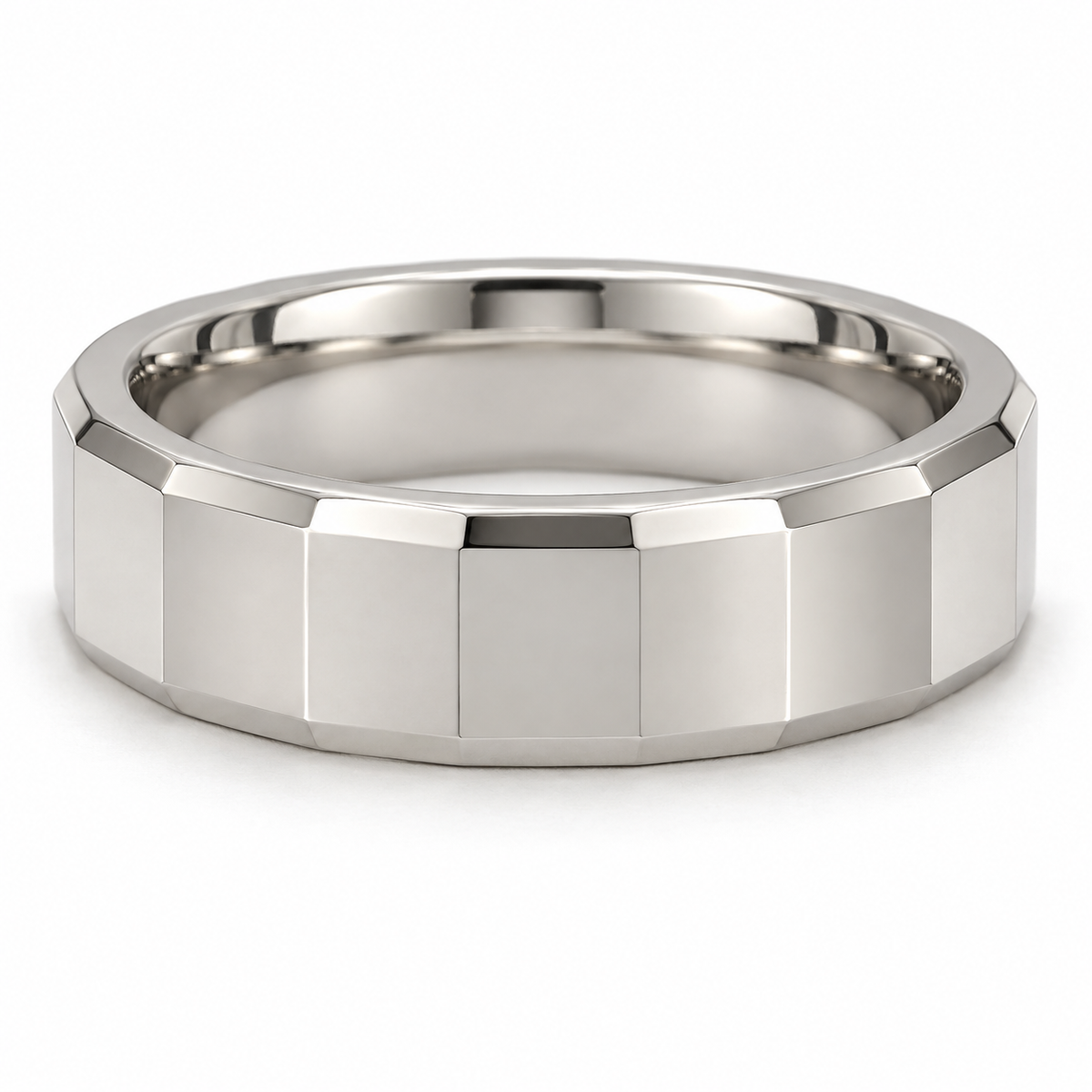 [metal:white-gold] Alden Faceted Band — front — Broad polished facets with bevelled edges and a smooth rounded interior, shallow front studio view [catalog-v4]