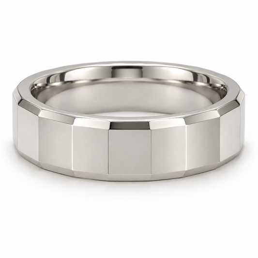 [metal:white-gold] Alden Faceted Band — front — Broad polished facets with bevelled edges and a smooth rounded interior, shallow front studio view [catalog-v4]