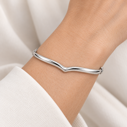 [metal:all] Althea Chevron Bangle — worn — Human-worn styling illustration [catalog-v4]