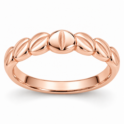 [metal:rose-gold] Alysienne Lozenge Band — front — Womens slender closed continuous band made of seven gently puffed polished lozenge-shaped metal panels across top half, seamlessly joined to plain smooth lower band. Each lozenge has a narrow satin central depression. Circular comfort-fit bore, no diamonds. [catalog-v4]