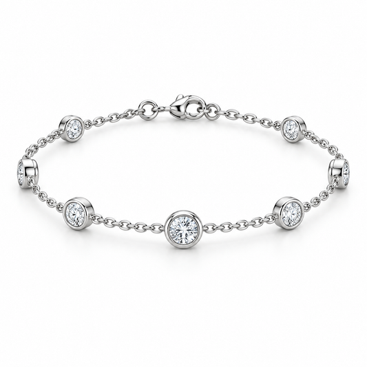 [metal:white-gold] Amara Bezel Bracelet — front — Bezel station bracelet, low oblique studio view [catalog-v4]