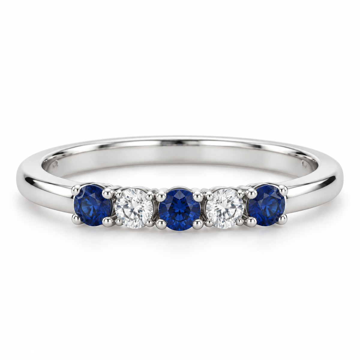 [metal:white-gold] Amelie Sapphire Accent Band — front — slender polished band with five round stones across front ordered blue sapphire white diamond blue sapphire white diamond blue sapphire, front view [catalog-v4]
