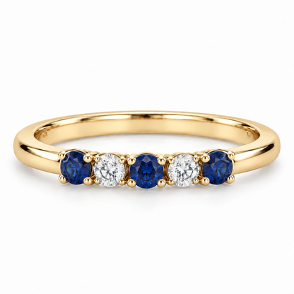 [metal:yellow-gold] Amelie Sapphire Accent Band — front — slender polished band with five round stones across front ordered blue sapphire white diamond blue sapphire white diamond blue sapphire, front view [catalog-v4]