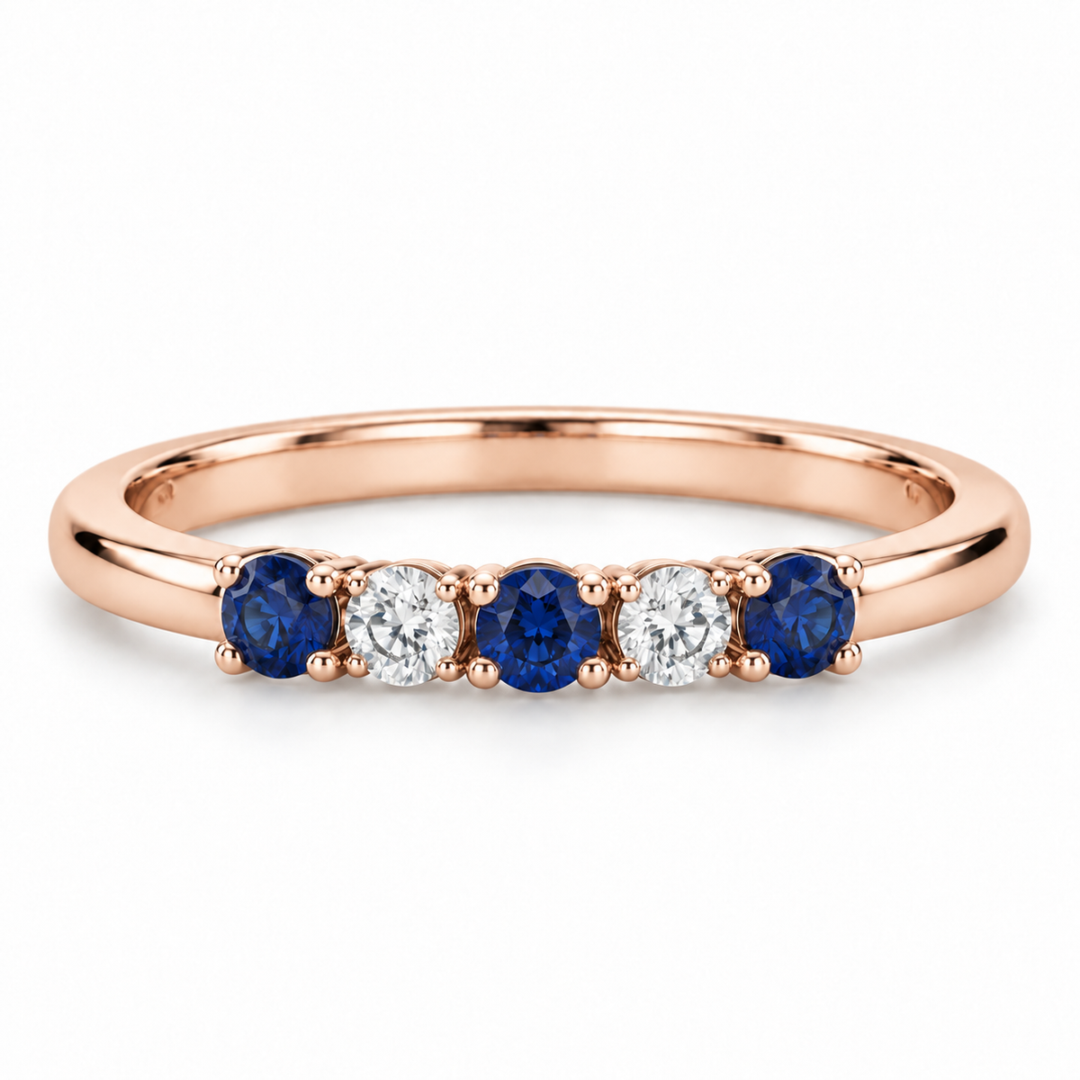 [metal:rose-gold] Amelie Sapphire Accent Band — front — slender polished band with five round stones across front ordered blue sapphire white diamond blue sapphire white diamond blue sapphire, front view [catalog-v4]