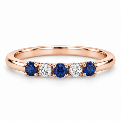 [metal:rose-gold] Amelie Sapphire Accent Band — front — slender polished band with five round stones across front ordered blue sapphire white diamond blue sapphire white diamond blue sapphire, front view [catalog-v4]