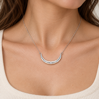 [metal:all] Arietta Crescent Necklace — worn — Human-worn styling illustration [catalog-v4]