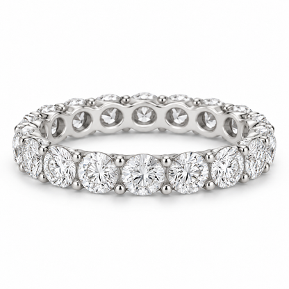 [metal:white-gold] Aveline Round Eternity Ring — front — Shared-prong round diamond eternity ring, shallow front studio view [catalog-v4]