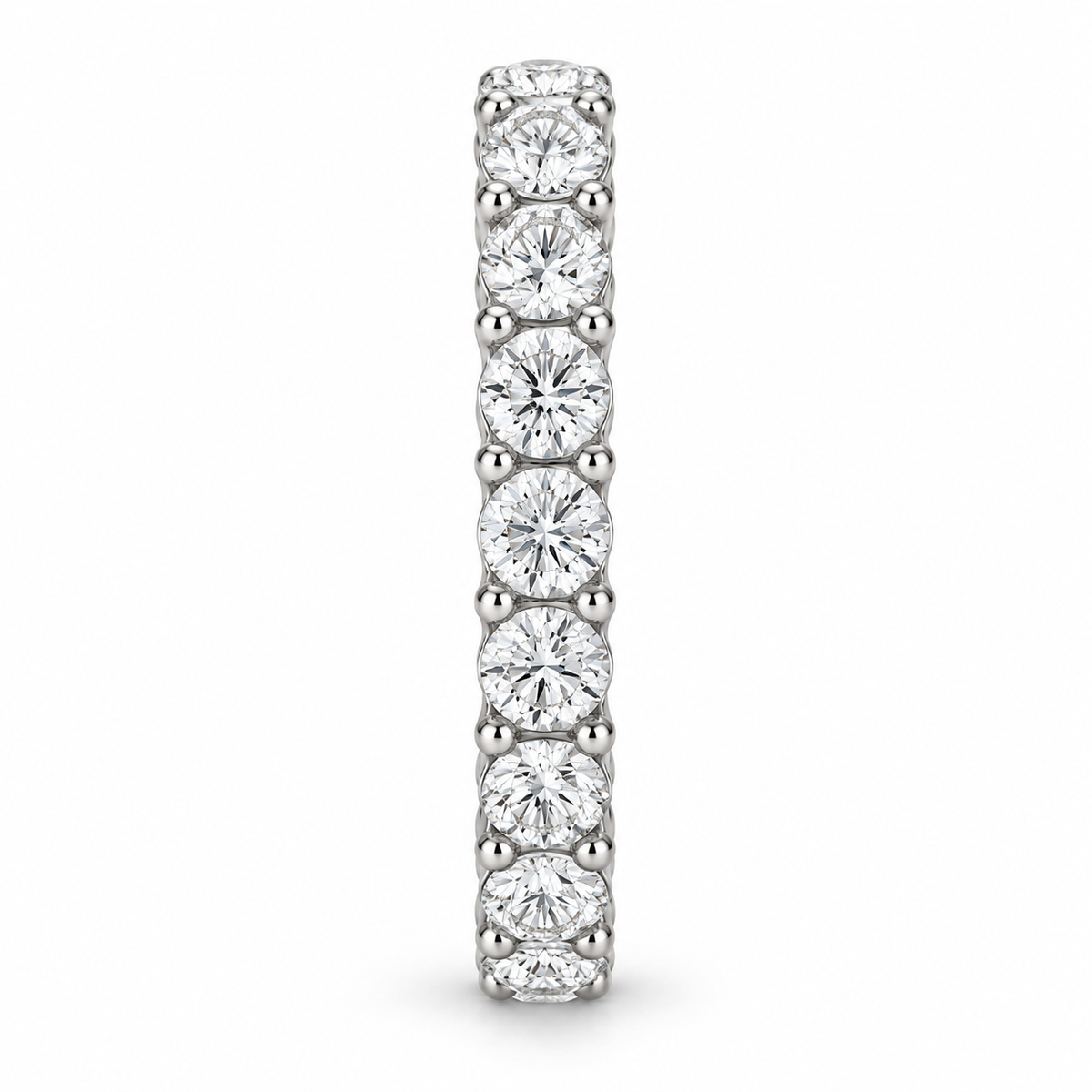 [metal:white-gold] Aveline Round Eternity Ring — side-profile — Shared-prong round diamond eternity ring, edge profile studio view [catalog-v4]