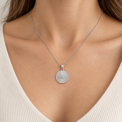 [metal:all] Avelise Sunray Medallion — worn — Human-worn styling illustration [catalog-v4]