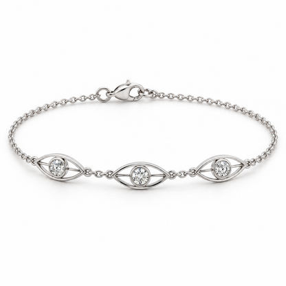[metal:white-gold] Avenisse Lens Station Bracelet — front — Fine cable chain with exactly three slim east-west open pointed-oval lens frames. Each frame contains one round diamond in a small circular bezel at its centre, joined to lens ends by short metal bars. Three frames evenly spaced at front, lobster clasp at rear. [catalog-v4]
