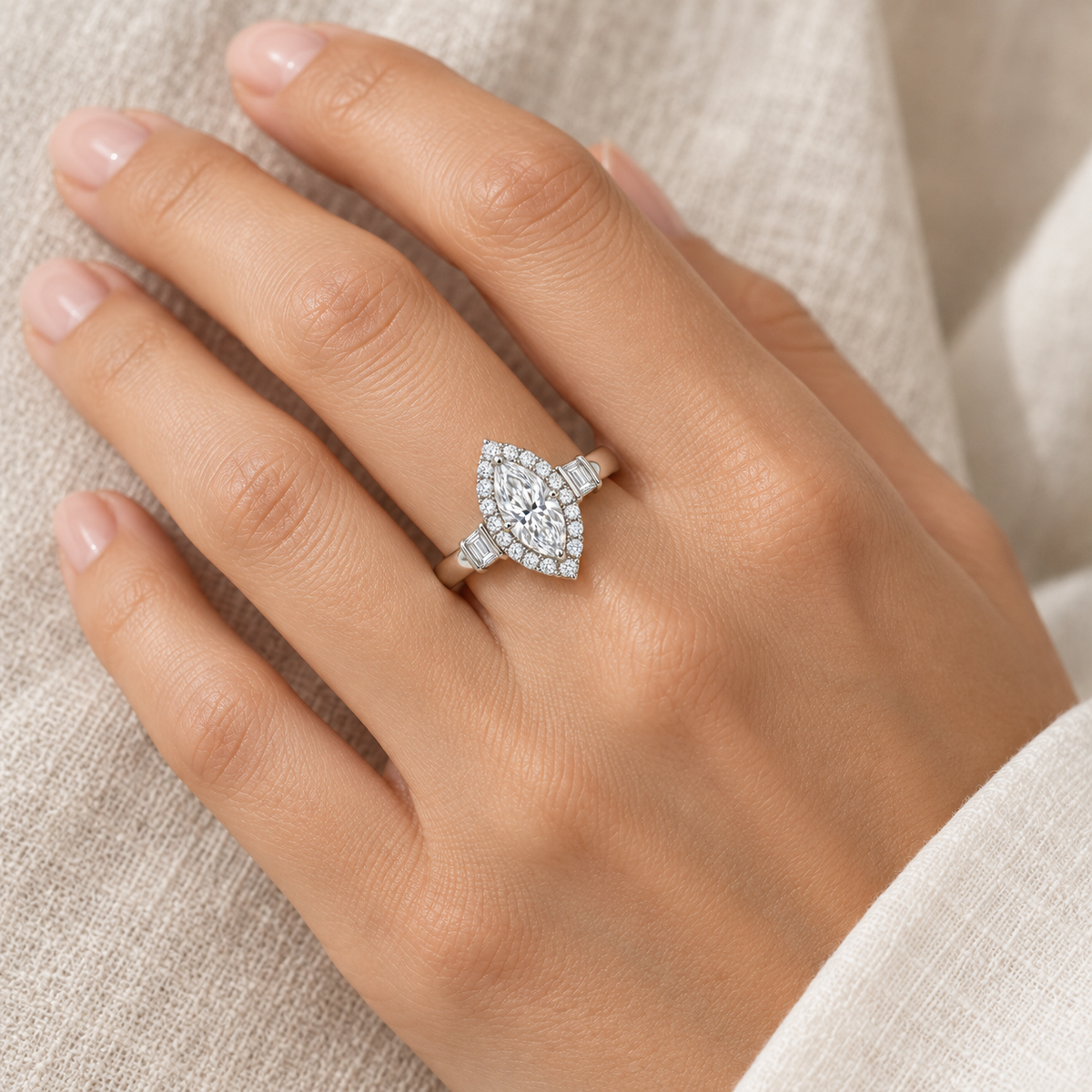 [metal:all] Azeline Marquise Halo Setting — worn — Human-worn styling illustration; proportions are not calibrated [catalog-v4]