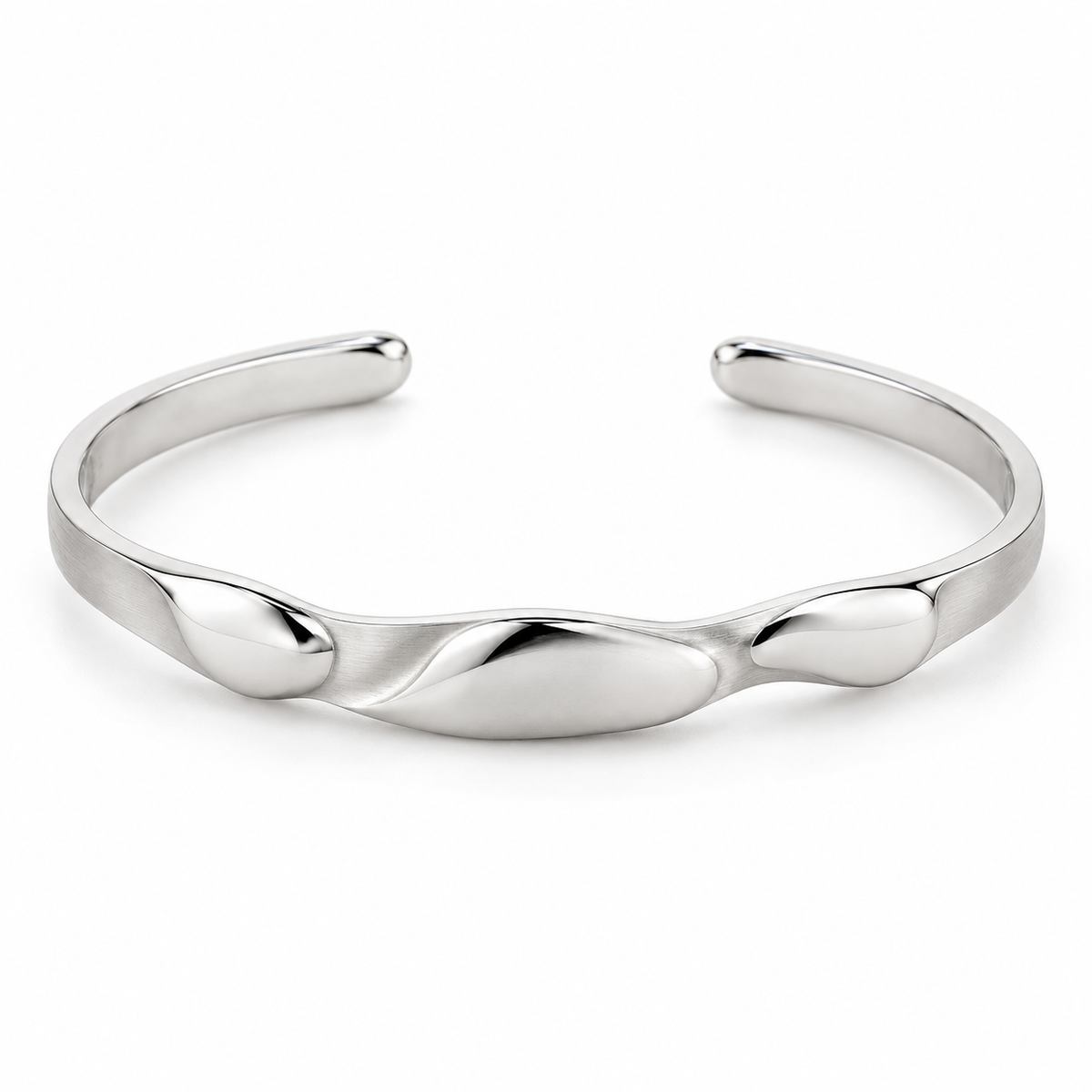 [metal:white-gold] Beliora Pebble Cuff — front — One open oval solid cuff with three shallow smooth asymmetric pebble lobes sculpted into its front surface, seamlessly joined to a single continuous narrow flat satin cuff. Rounded polished tips, rear opening, no floating links and no stones. [catalog-v4]