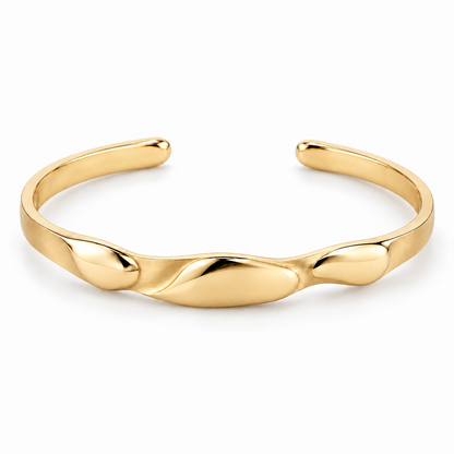 [metal:yellow-gold] Beliora Pebble Cuff — front — One open oval solid cuff with three shallow smooth asymmetric pebble lobes sculpted into its front surface, seamlessly joined to a single continuous narrow flat satin cuff. Rounded polished tips, rear opening, no floating links and no stones. [catalog-v4]