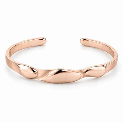 [metal:rose-gold] Beliora Pebble Cuff — front — One open oval solid cuff with three shallow smooth asymmetric pebble lobes sculpted into its front surface, seamlessly joined to a single continuous narrow flat satin cuff. Rounded polished tips, rear opening, no floating links and no stones. [catalog-v4]