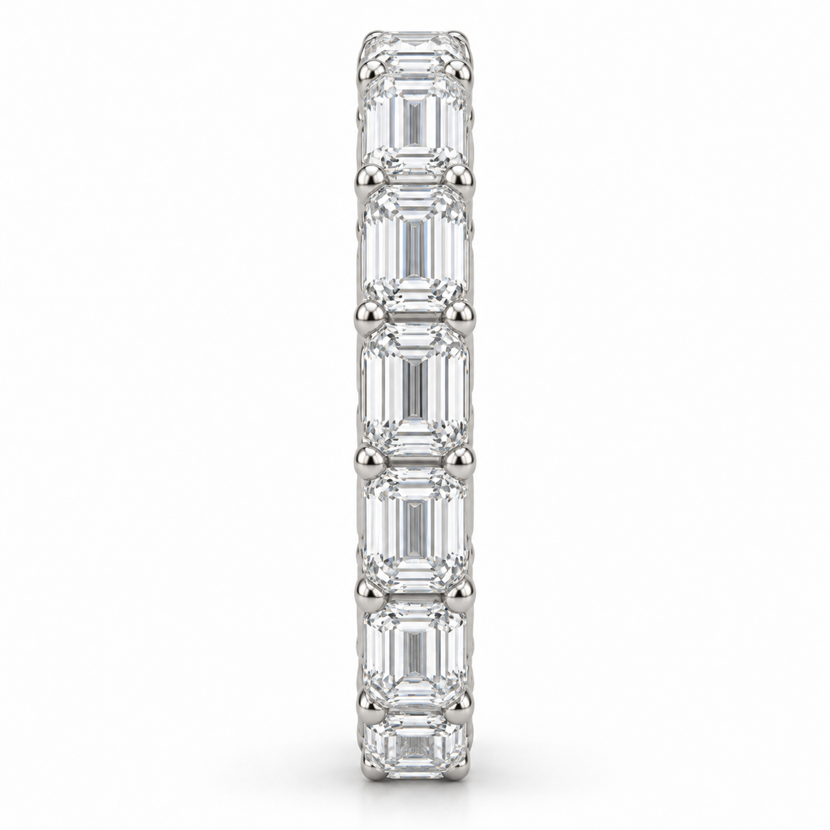 [metal:white-gold] Brielle Emerald Eternity Ring — side-profile — East-west emerald-cut diamond eternity ring, edge profile studio view [catalog-v4]
