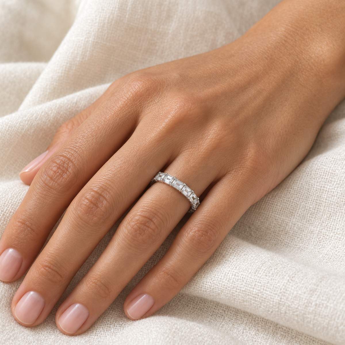 [metal:all] Brielle Emerald Eternity Ring — worn — Human-worn styling illustration [catalog-v4]