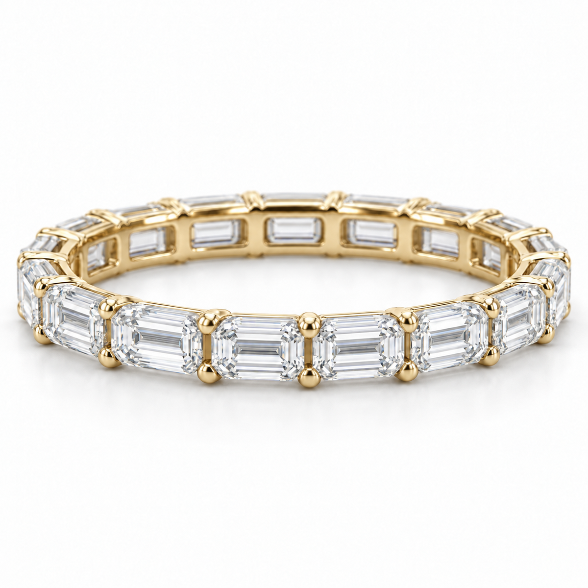 [metal:yellow-gold] Brielle Emerald Eternity Ring — front — Yellow gold colour preview [catalog-v4]