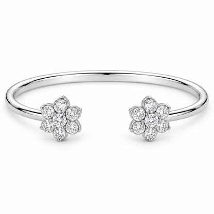 [metal:white-gold] Camellia Cuff — front — Open cuff with two floral diamond clusters, low oblique studio view [catalog-v4]