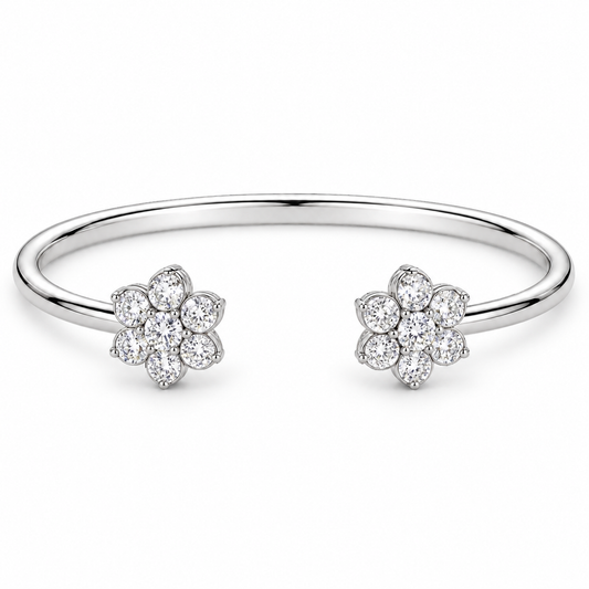 [metal:white-gold] Camellia Cuff — front — Open cuff with two floral diamond clusters, low oblique studio view [catalog-v4]
