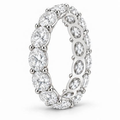 [metal:white-gold] Colette Oval Eternity Ring — three-quarter — Oval diamond eternity ring, standing oblique studio view [catalog-v4]