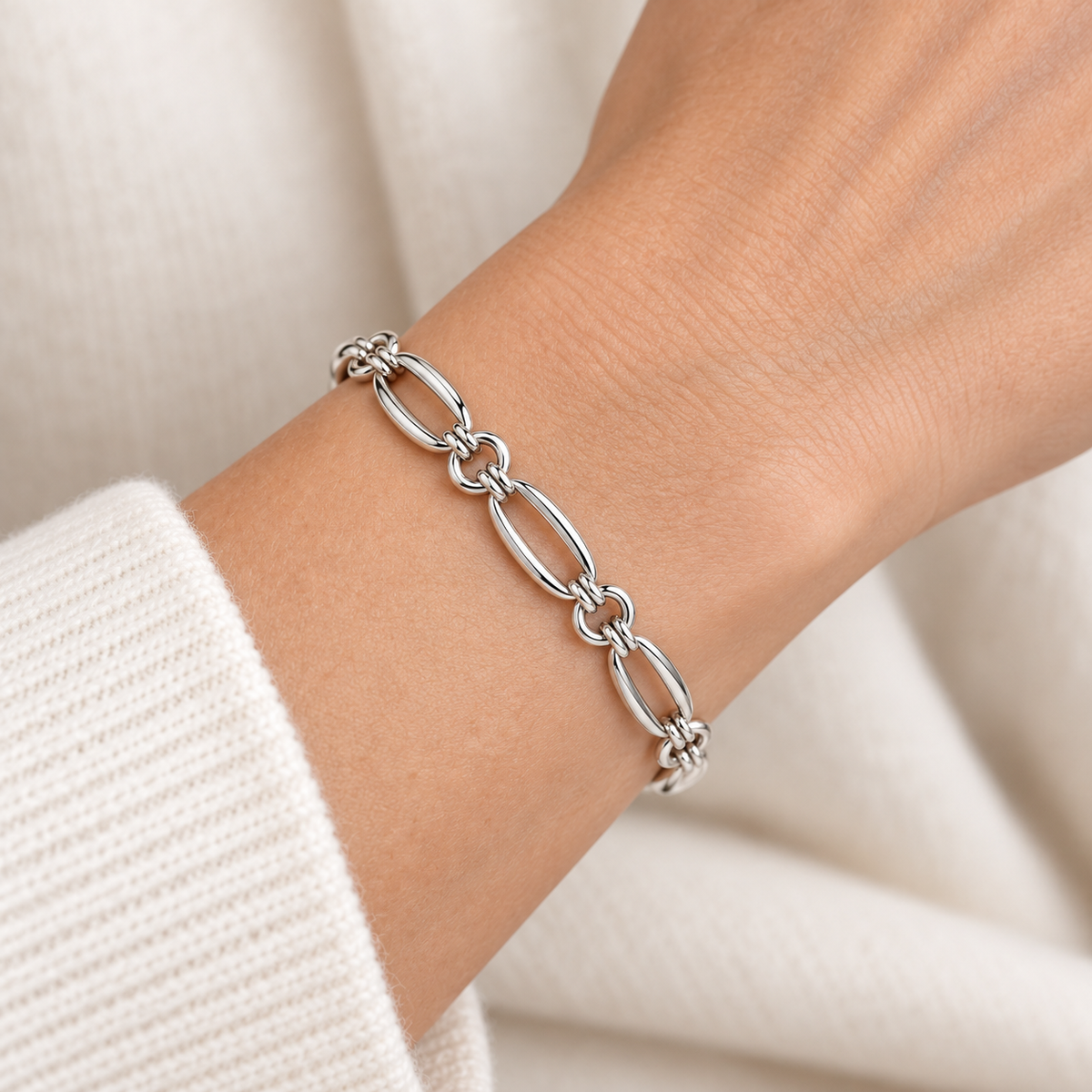 [metal:all] Coralie Oval Link Bracelet — worn — Human-worn styling illustration [catalog-v4]