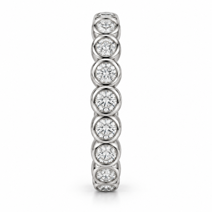 [metal:white-gold] Eloise Bezel Eternity Ring — side-profile — Round diamond bezel eternity ring, edge profile studio view [catalog-v4]