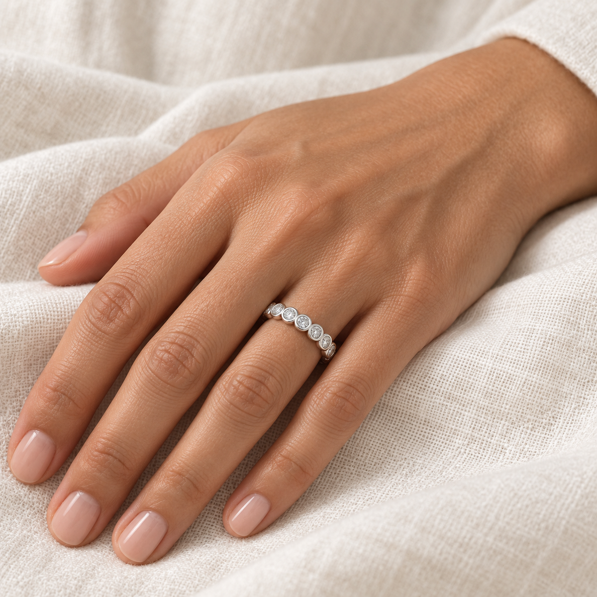 [metal:all] Eloise Bezel Eternity Ring — worn — Human-worn styling illustration [catalog-v4]