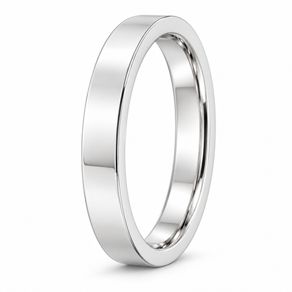 [metal:white-gold] Emmeline Flat Band — three-quarter — Flat-profile band, standing oblique studio view [catalog-v4]