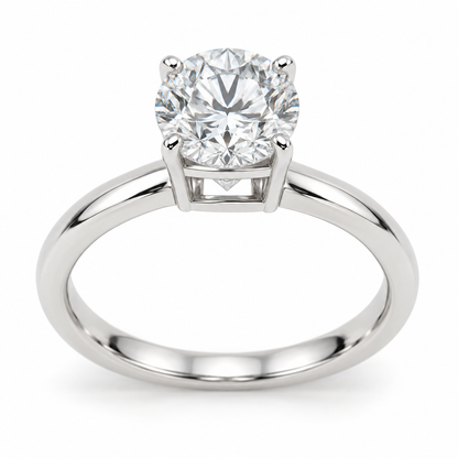 [metal:white-gold] Esmeria Lantern Solitaire Setting — front — One round centre in four claws above a compact rectangular lantern basket: four straight corner pillars, a fine upper girdle rail and a flat lower bridge, four rectangular open side windows. Plain 2 mm rounded shank, no shoulder diamonds, no split shank. [catalog-v4]
