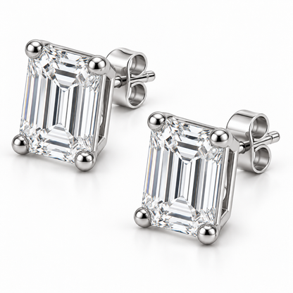 [metal:white-gold] Estelle Emerald-Cut Studs — three-quarter — Oblique view showing baskets and butterfly backs [catalog-v4]