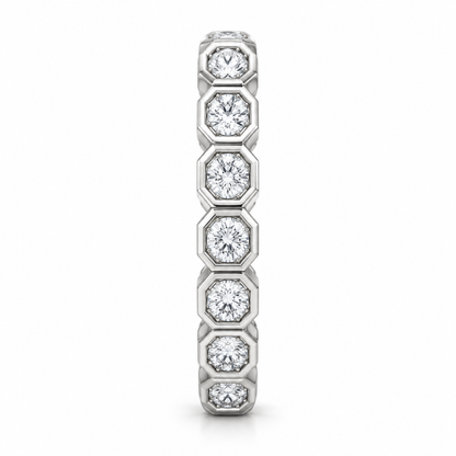 [metal:white-gold] Estrella Octagonal Bezel Eternity Ring — side-profile — full eternity ring of round diamonds each within separate octagonal metal bezel, continuous linked sequence, side-profile view [catalog-v4]