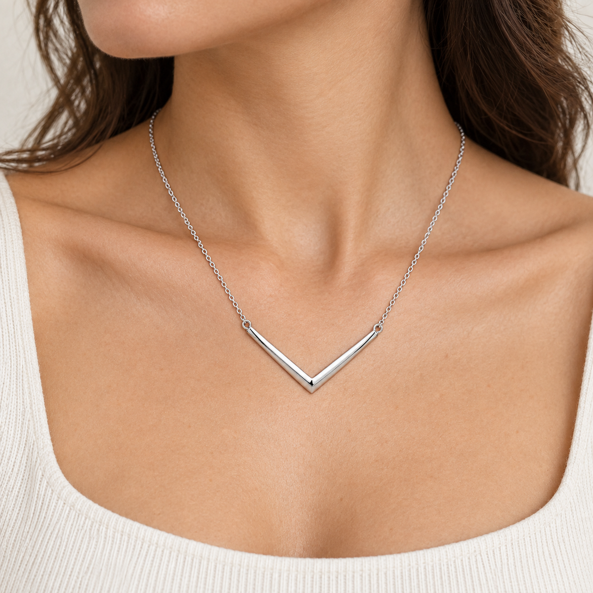 [metal:all] Evadne Chevron Necklace — worn — Human-worn styling illustration [catalog-v4]