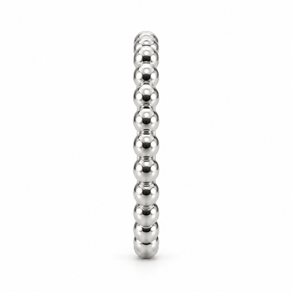 [metal:white-gold] Evelise Beaded Band — side-profile — slim continuous band of evenly sized polished metal beads joined to a smooth inner ring, no stones, side-profile view [catalog-v4]