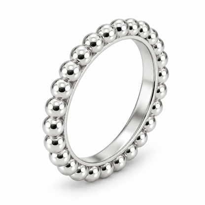 [metal:white-gold] Evelise Beaded Band — three-quarter — slim continuous band of evenly sized polished metal beads joined to a smooth inner ring, no stones, three-quarter view [catalog-v4]