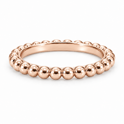[metal:rose-gold] Evelise Beaded Band — front — slim continuous band of evenly sized polished metal beads joined to a smooth inner ring, no stones, front view [catalog-v4]