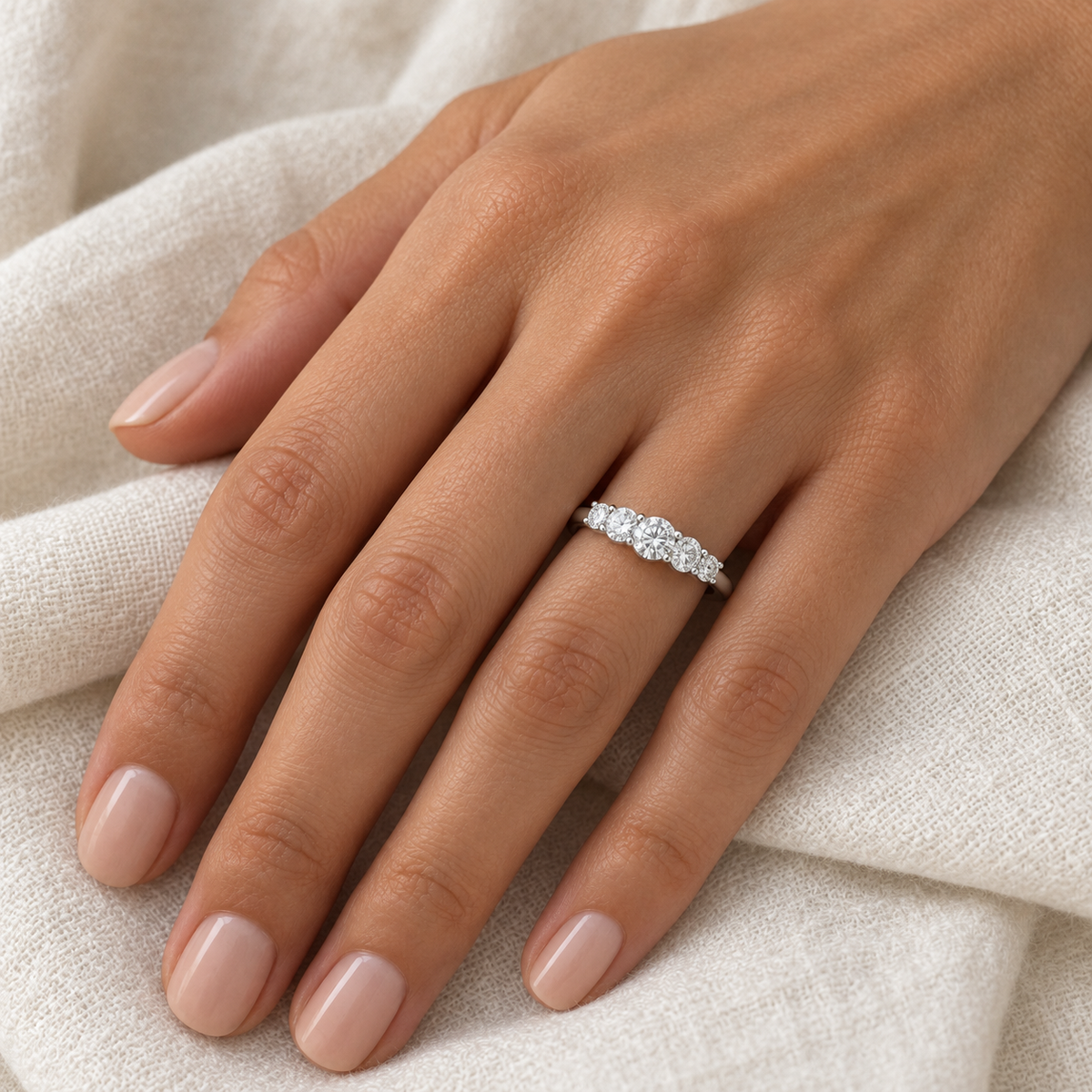 [metal:all] Felicite Five-Stone Ring — worn — Human-worn styling illustration [catalog-v4]