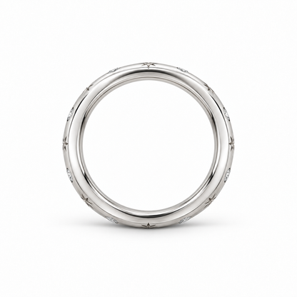 [metal:white-gold] Freya Celestial Ring — top — Star-engraved diamond band, circular elevation studio view [catalog-v4]