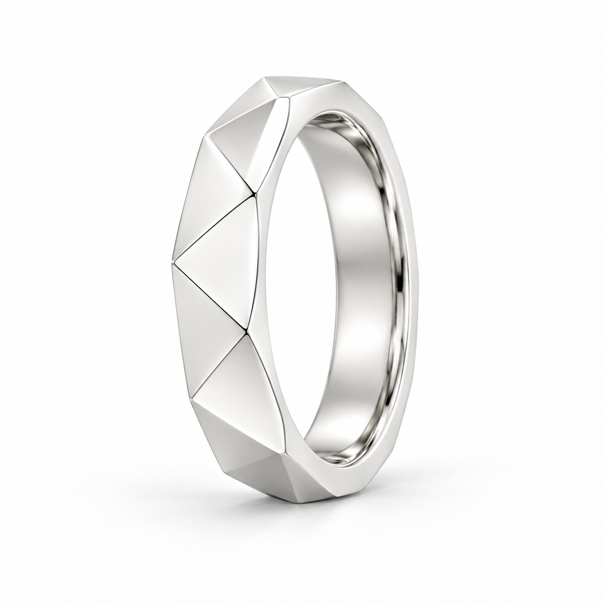 [metal:white-gold] Galatea Geometric Ring — three-quarter — Angular faceted band, standing oblique studio view [catalog-v4]