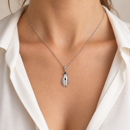Glacielle Penguin Pendant — worn view — [metal:all] — Model styling:19-inch (48.3 cm) chain; pendant sold separately