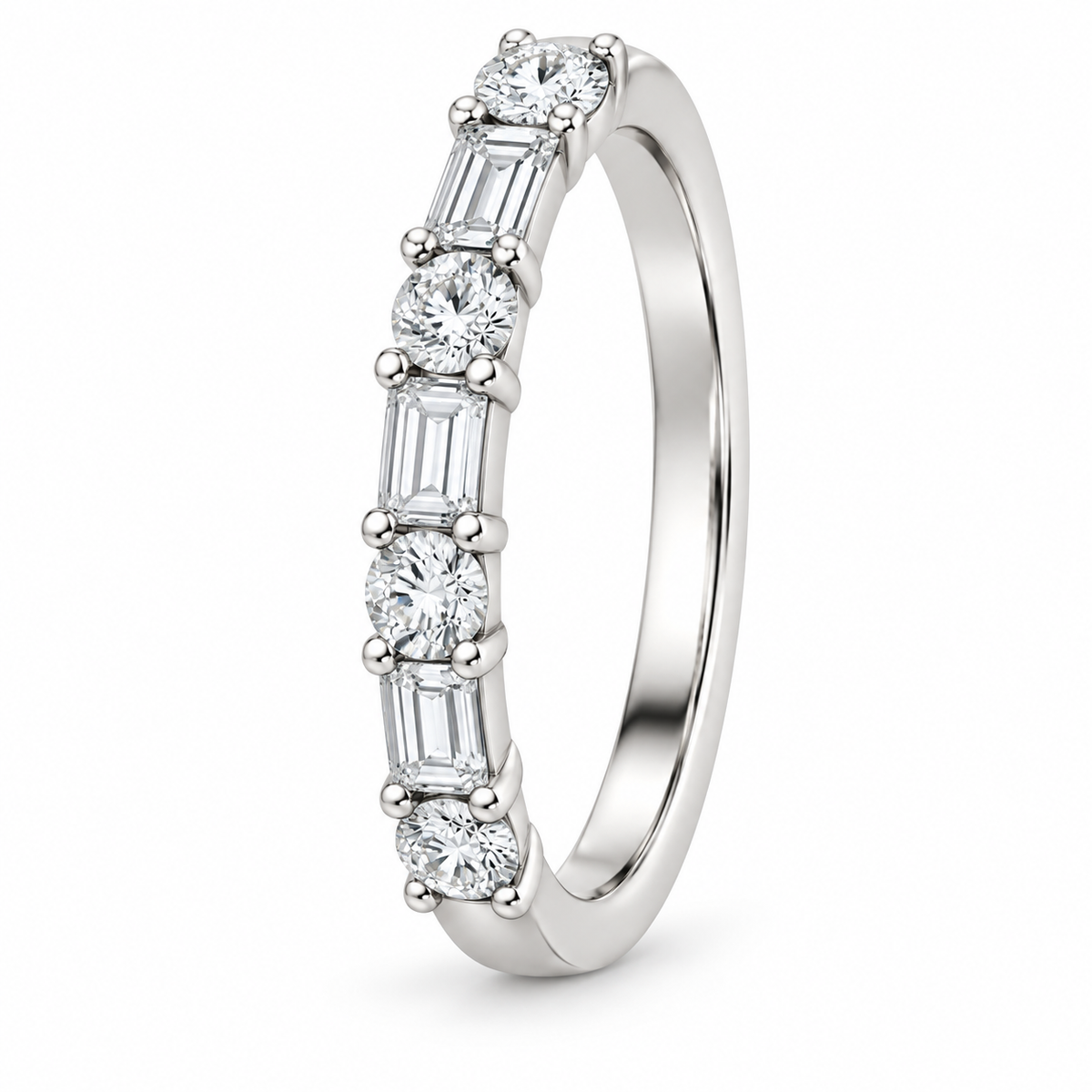 [metal:white-gold] Henriette Baguette Ring — three-quarter — Alternating baguette and round diamond band, standing oblique studio view [catalog-v4]
