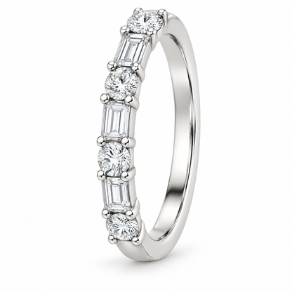 [metal:white-gold] Henriette Baguette Ring — three-quarter — Alternating baguette and round diamond band, standing oblique studio view [catalog-v4]