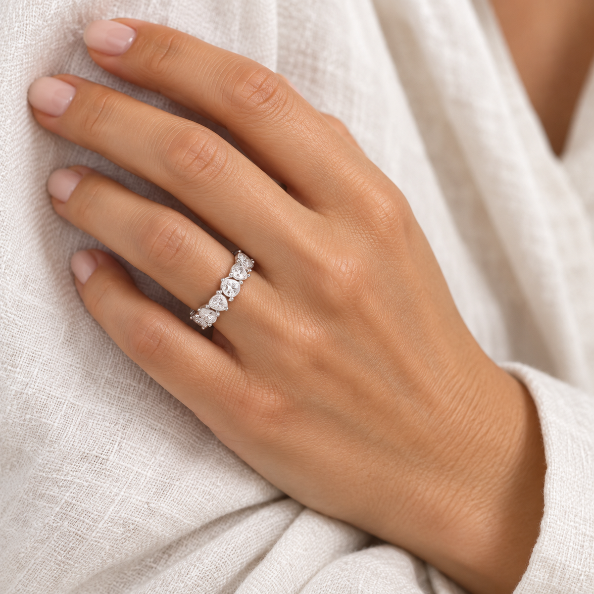 [metal:all] Honora Pear Eternity Ring — worn — Human-worn styling illustration [catalog-v4]