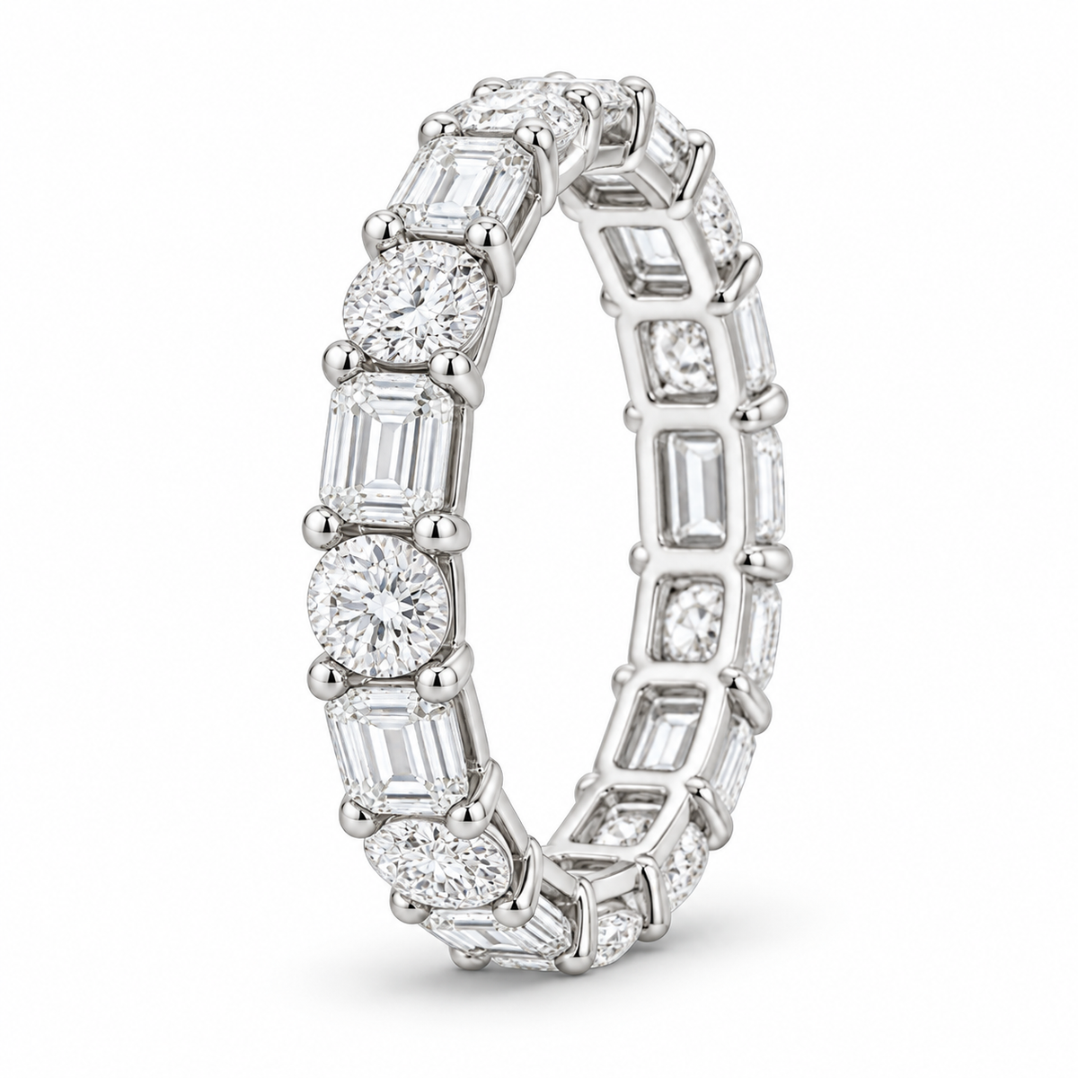 [metal:white-gold] Iris Mixed-Cut Eternity Ring — three-quarter — Mixed-cut diamond eternity ring, standing oblique studio view [catalog-v4]