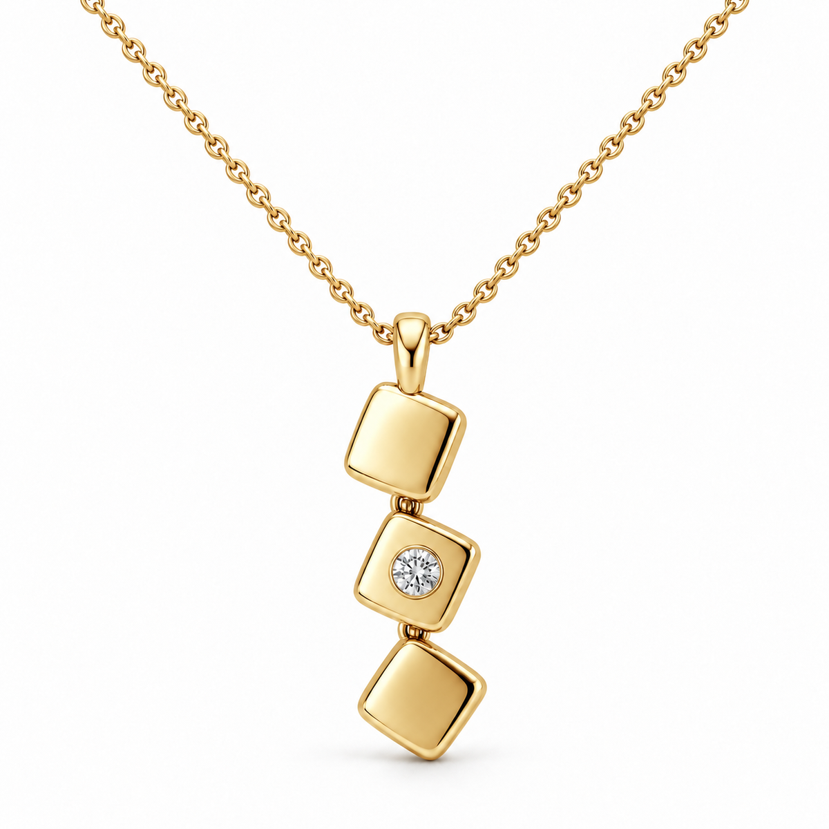[metal:yellow-gold] Iserelle Offset Tile Necklace — front — Three small solid polished rounded-square metal tiles in a stepped diagonal cascade, hinged by tiny concealed links, each tile rotated slightly differently. Middle tile alone has one small flush-set round diamond. Fine cable chain through top tile bail. [catalog-v4]