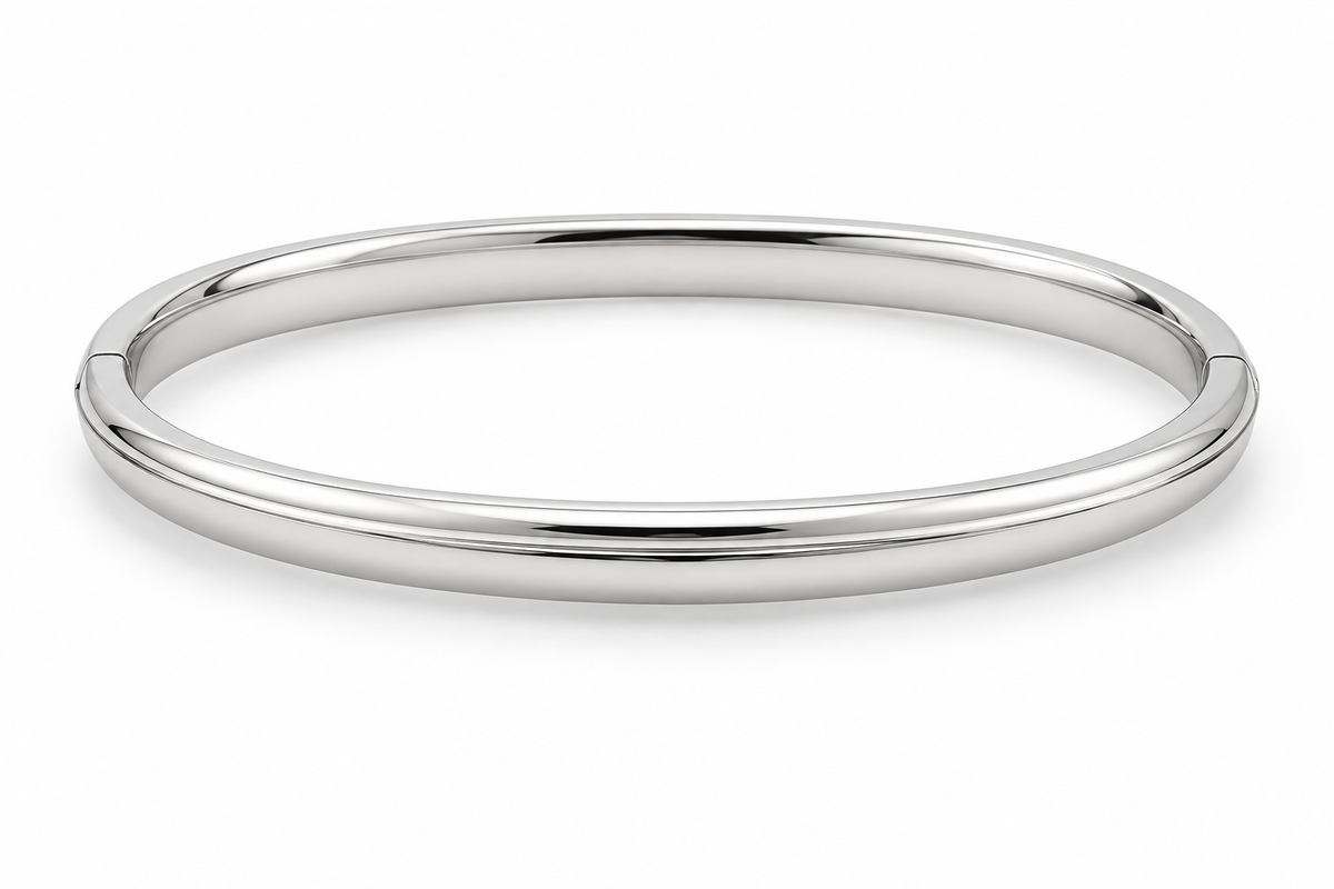 [metal:white-gold] Isola Hinged Oval Bangle — front — plain polished oval hinged bangle with a subtle raised centre ridge and hidden clasp, no stones, front view [catalog-v4]