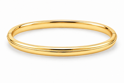 [metal:yellow-gold] Isola Hinged Oval Bangle — front — plain polished oval hinged bangle with a subtle raised centre ridge and hidden clasp, no stones, front view [catalog-v4]