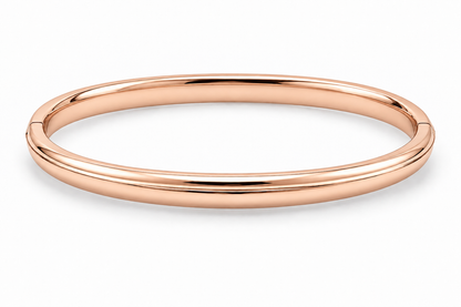 [metal:rose-gold] Isola Hinged Oval Bangle — front — plain polished oval hinged bangle with a subtle raised centre ridge and hidden clasp, no stones, front view [catalog-v4]