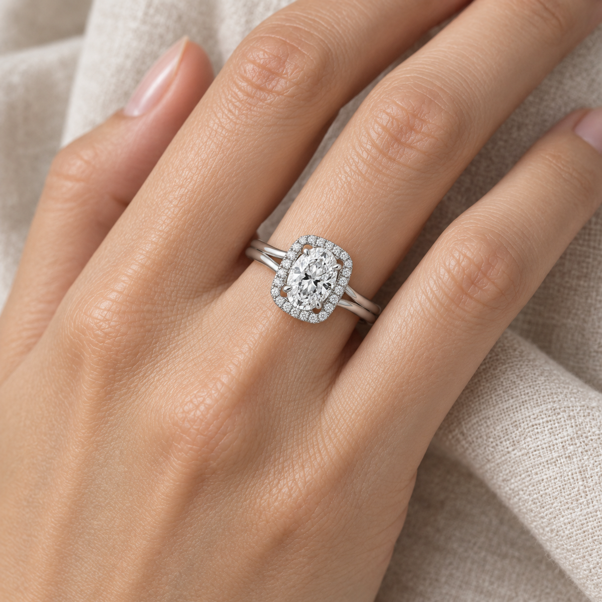 [metal:all] Ivelle Open-Cushion Halo Setting — worn — Human-worn styling illustration; proportions are not calibrated [catalog-v4]