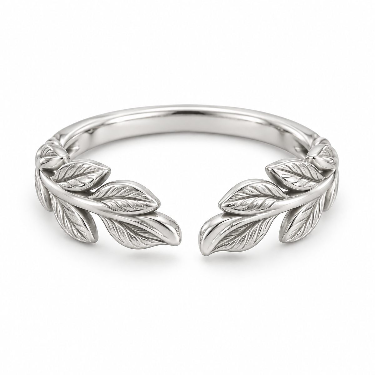 [metal:white-gold] Juniper Laurel Ring — front — Open engraved laurel-leaf band, shallow front studio view [catalog-v4]