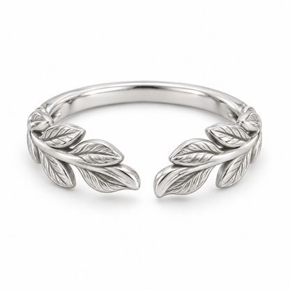 [metal:white-gold] Juniper Laurel Ring — front — Open engraved laurel-leaf band, shallow front studio view [catalog-v4]